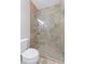 Bathroom with glass shower enclosure and tile surround at 735 River Ridge Ln, Suwanee, GA 30024