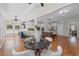 Charming breakfast nook featuring hardwood floors and seamlessly connected to the kitchen at 735 River Ridge Ln, Suwanee, GA 30024