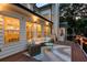 Inviting outdoor deck with seating, string lights, and backyard view at 735 River Ridge Ln, Suwanee, GA 30024