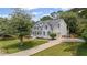 Stunning two-story home boasts a manicured lawn and an inviting driveway leading to a two-car garage at 735 River Ridge Ln, Suwanee, GA 30024