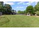 Expansive green space including a playground, pool, and a picnic pavilion at 735 River Ridge Ln, Suwanee, GA 30024