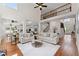 Expansive open-concept living room featuring hardwood floors, a staircase and soaring two-story ceilings at 735 River Ridge Ln, Suwanee, GA 30024
