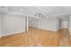 Large living room with hardwood flooring, recessed lighting, and decorative columns at 735 River Ridge Ln, Suwanee, GA 30024