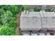 Aerial view of townhome community with well-maintained roofs and landscaping at 747 Topsail Ln, Alpharetta, GA 30005