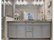 Modern bathroom with double sinks, granite countertop, framed mirrors, modern fixtures, and gray cabinetry at 747 Topsail Ln, Alpharetta, GA 30005