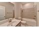 Bathroom featuring a modern vanity, toilet, and bathtub with stylish tile surround at 747 Topsail Ln, Alpharetta, GA 30005