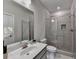 Modern bathroom with a glass-enclosed shower, large mirror, and stylish vanity at 747 Topsail Ln, Alpharetta, GA 30005