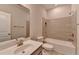 Bathroom featuring a modern vanity, toilet, and bathtub with stylish tile surround at 747 Topsail Ln, Alpharetta, GA 30005