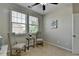 Bedroom featuring two chairs, a side table, natural light, and neutral wall paint at 747 Topsail Ln, Alpharetta, GA 30005