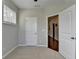 Bright bedroom features neutral walls, carpet, a window with blinds, and white trim at 747 Topsail Ln, Alpharetta, GA 30005