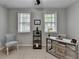 Bedroom with two windows, neutral walls and carpet, and a ceiling fan at 747 Topsail Ln, Alpharetta, GA 30005