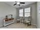 Bedroom featuring a ceiling fan, two windows, and neutral walls and carpet at 747 Topsail Ln, Alpharetta, GA 30005