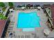 Community pool with plenty of lounge seating and umbrellas near attractive townhomes in a Gathering friendly community at 747 Topsail Ln, Alpharetta, GA 30005