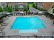 Large community pool with plenty of lounge seating and umbrellas near attractive townhomes in a Gathering friendly community at 747 Topsail Ln, Alpharetta, GA 30005