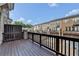 Private deck with wood railings offers a view of the townhome community at 747 Topsail Ln, Alpharetta, GA 30005