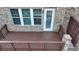 Private wooden deck offers outdoor living with brick facade and white door at 747 Topsail Ln, Alpharetta, GA 30005