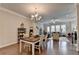 Dining area featuring hardwood floors adjoins a living room and offers ample space at 747 Topsail Ln, Alpharetta, GA 30005