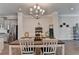 Open concept dining area featuring hardwood floors and easy access to the kitchen at 747 Topsail Ln, Alpharetta, GA 30005