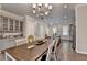 Charming dining space adjacent to the kitchen with a view of the kitchen island at 747 Topsail Ln, Alpharetta, GA 30005