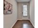 Well-lit entryway with wood floors and door leading outside at 747 Topsail Ln, Alpharetta, GA 30005