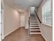 Bright entryway with hardwood floors and a staircase leading to the upper level at 747 Topsail Ln, Alpharetta, GA 30005