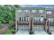 Beautiful brick townhome featuring a two-car garage and an upper level walk-out deck at 747 Topsail Ln, Alpharetta, GA 30005