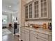 Hallway with decorative countertops and cabinets flows seamlessly from the living room at 747 Topsail Ln, Alpharetta, GA 30005
