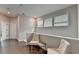 Inviting hallway with hardwood floors, neutral walls, comfortable seating and natural light at 747 Topsail Ln, Alpharetta, GA 30005