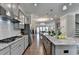 Spacious kitchen with granite countertops, stainless appliances, and open layout at 747 Topsail Ln, Alpharetta, GA 30005