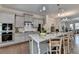 Contemporary kitchen with granite countertops, stainless steel appliances, and eat-in island at 747 Topsail Ln, Alpharetta, GA 30005