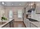 Gourmet kitchen featuring modern appliances and granite countertops at 747 Topsail Ln, Alpharetta, GA 30005