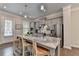Well-lit kitchen featuring granite countertops, modern appliances, an island and a door to the outside at 747 Topsail Ln, Alpharetta, GA 30005