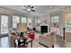 Bright living room features large windows, a fireplace, and hardwood floors at 747 Topsail Ln, Alpharetta, GA 30005