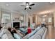 Spacious living room with fireplace, ceiling fan, hardwood floors and elegant decor at 747 Topsail Ln, Alpharetta, GA 30005