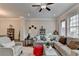 Inviting living room with plush sectional sofa, stylish decor, and ample natural light at 747 Topsail Ln, Alpharetta, GA 30005