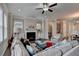 Spacious living room with lots of natural light, a fireplace, and hardwood floors at 747 Topsail Ln, Alpharetta, GA 30005