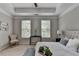 Bedroom with a large window, ceiling fan, and a small seating area at 747 Topsail Ln, Alpharetta, GA 30005