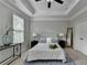 Bedroom featuring a ceiling fan, a large window, and two nightstands at 747 Topsail Ln, Alpharetta, GA 30005