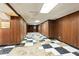 Expansive basement featuring unique flooring and wood-paneled walls, offering remodeling potential at 900 Fleetwood Cir, Atlanta, GA 30311