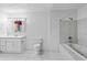 Bright bathroom with a tiled shower-tub and ample counter space at 900 Fleetwood Cir, Atlanta, GA 30311