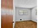 Cozy bedroom with natural light and neutral carpeting at 900 Fleetwood Cir, Atlanta, GA 30311