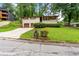 Charming single-Gathering home featuring a brick facade, well-maintained lawn, and a two-car garage at 900 Fleetwood Cir, Atlanta, GA 30311