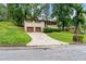 Single-Gathering home featuring a brick facade, well-maintained lawn, and a two-car garage at 900 Fleetwood Cir, Atlanta, GA 30311