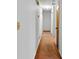 Hallway featuring neutral carpeting with multiple doors and access to different rooms at 900 Fleetwood Cir, Atlanta, GA 30311