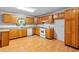 Well-lit kitchen with wood cabinetry, white appliances, and plenty of storage at 900 Fleetwood Cir, Atlanta, GA 30311