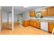 Kitchen with wood cabinets, laminate counters, and access to a sliding door at 900 Fleetwood Cir, Atlanta, GA 30311
