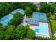 Aerial view of the community amenities including a swimming pool and tennis courts at 10645 Tuxford Dr, Alpharetta, GA 30022