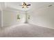 Expansive bedroom with neutral colors, carpeted floors, and recessed ceiling, for a peaceful retreat at 10645 Tuxford Dr, Alpharetta, GA 30022