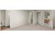 Spacious bedroom with neutral carpet, walk-in closet and access to an ensuite bathroom at 10645 Tuxford Dr, Alpharetta, GA 30022