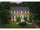 Charming brick two-story home featuring black shutters, manicured landscaping, and a welcoming front entrance at 10645 Tuxford Dr, Alpharetta, GA 30022